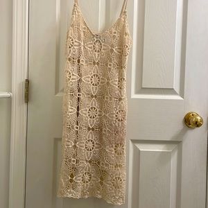 Cream-white crochet dress super cute with a demin, bomber or leather jacket.